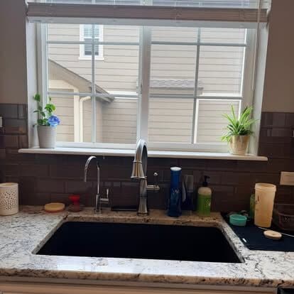 Kitchen sink and window sill wiped down and clear of clutter