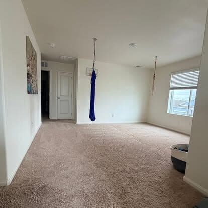 Empty carpeted room vacuumed and ready for handover